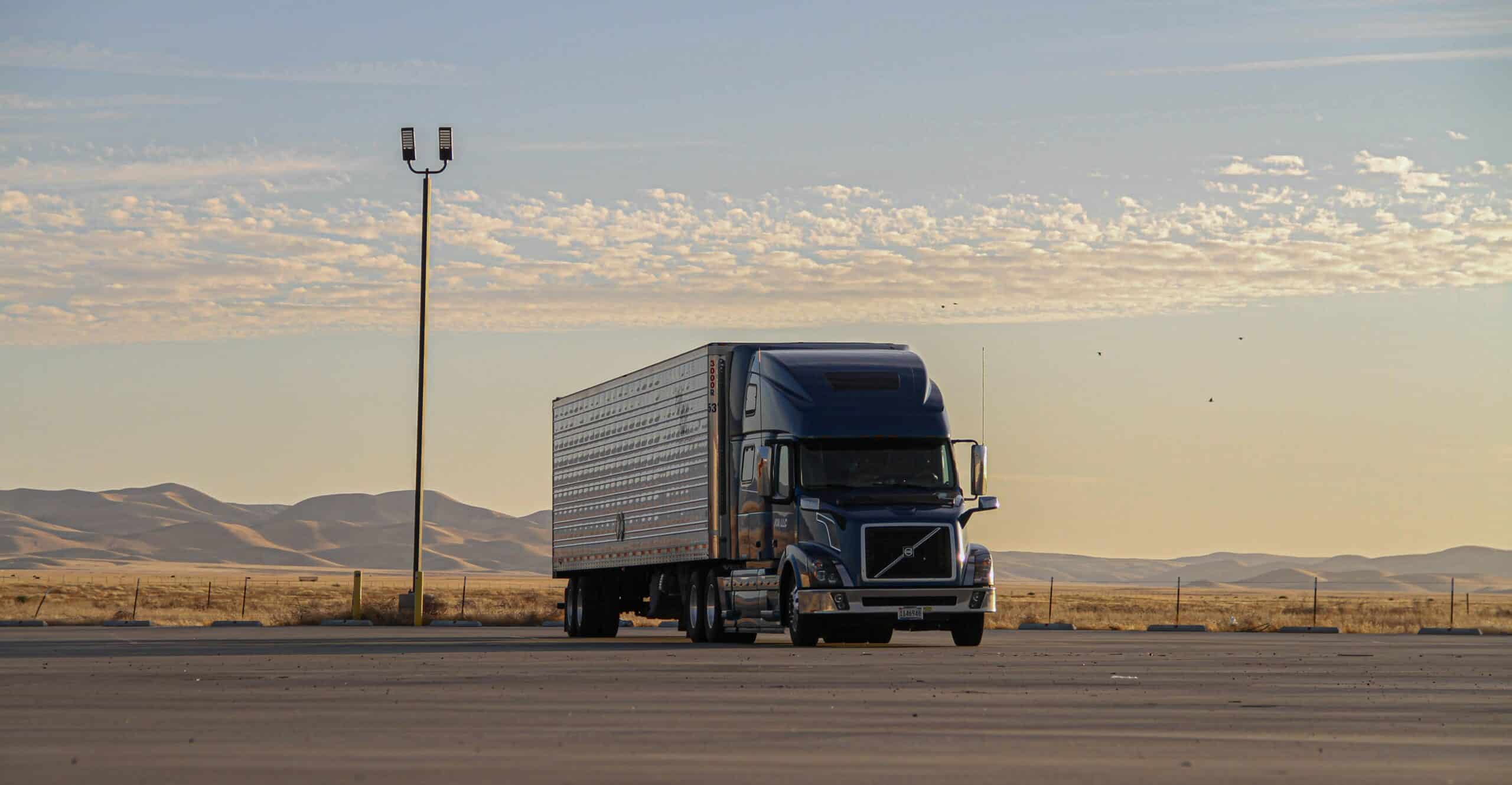 Truck driving in the sunset